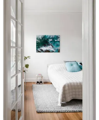 Fale uderzające o skały - obraz na płótnie